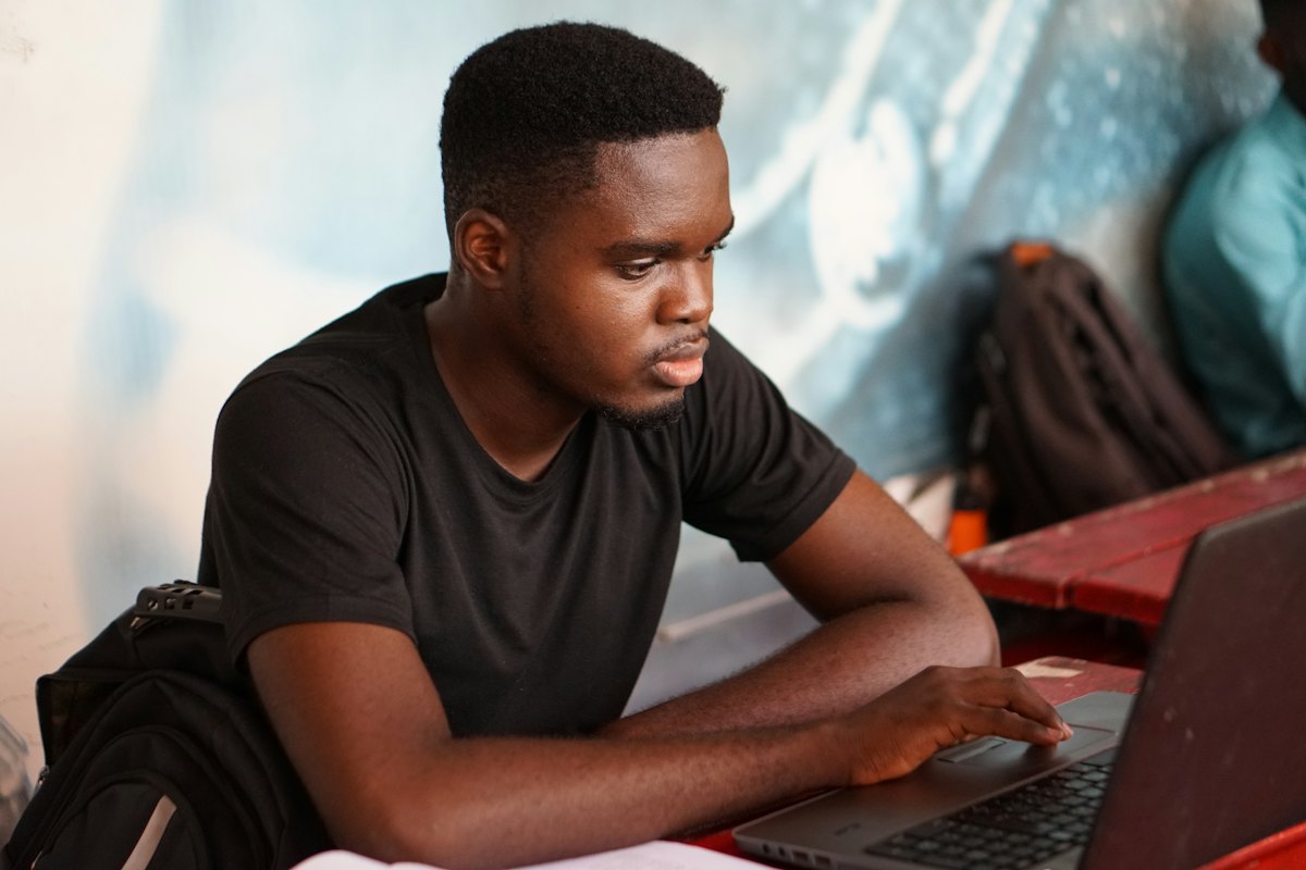 A learner working through a lesson on a laptop
